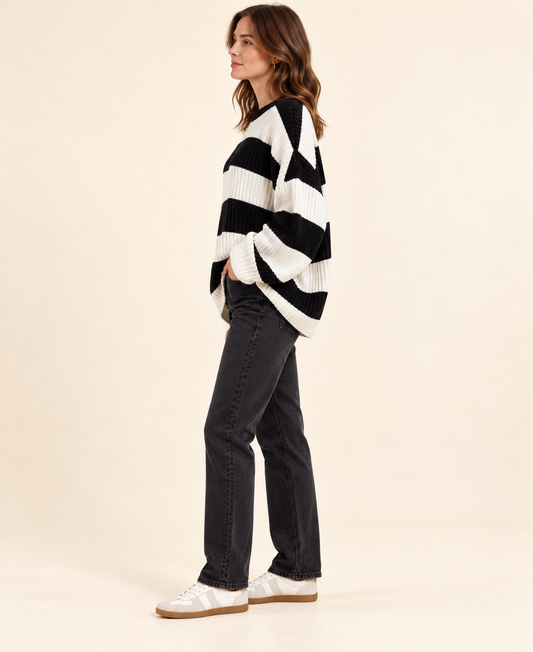 Black and ivory striped knit pullover sweater, side profile view