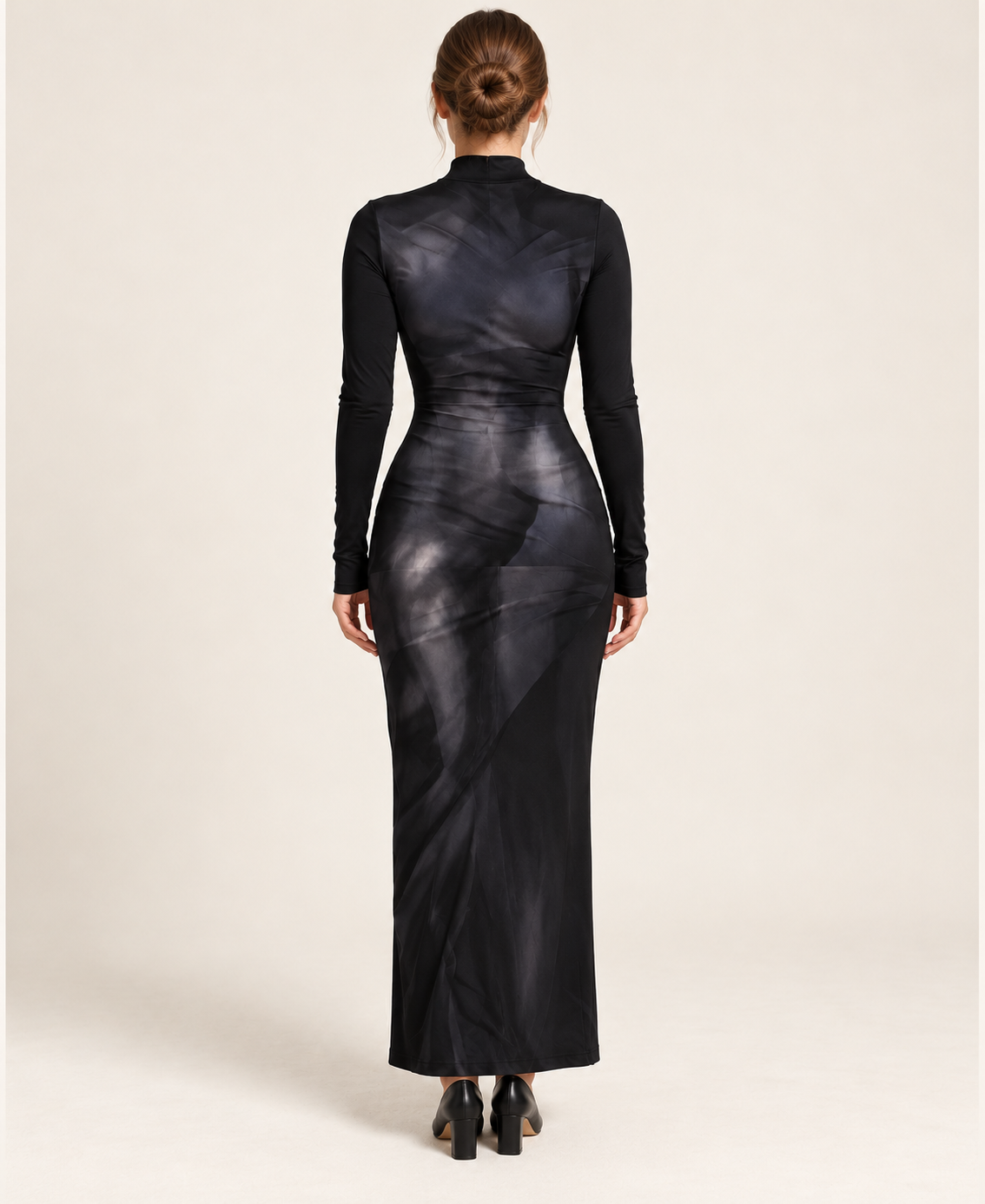 Model wearing the black 3D-style print long-sleeve fitted dress, full-length back view.