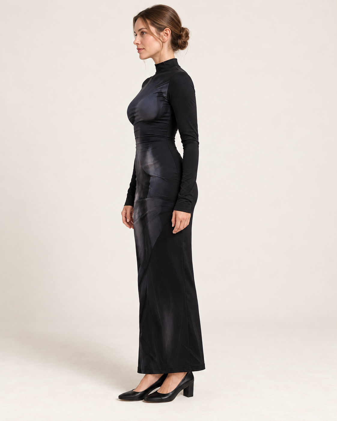 Model wearing the black 3D-style print long-sleeve fitted dress, side profile.