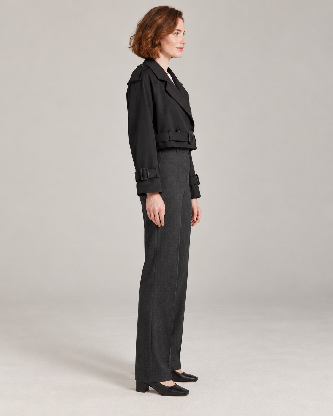 Black trench-style jacket, full-length side view