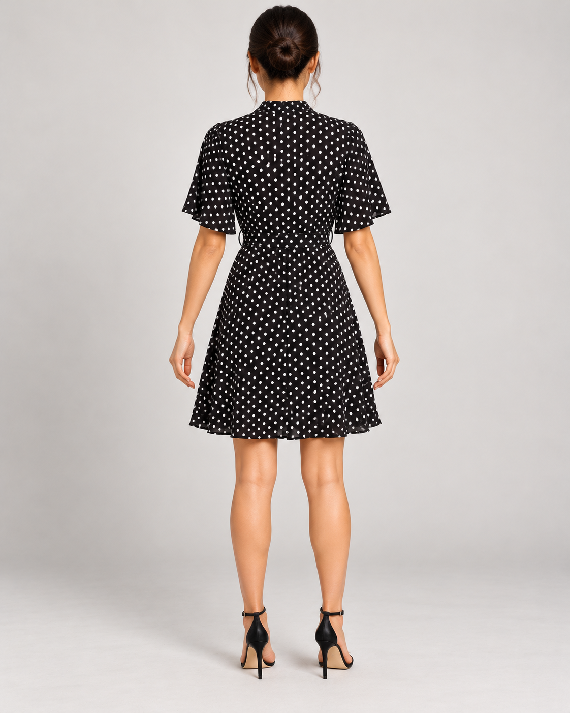 Black dress, full-length direct rear view
