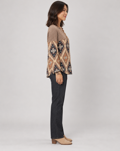 Brown geometric pullover top, full-length side view