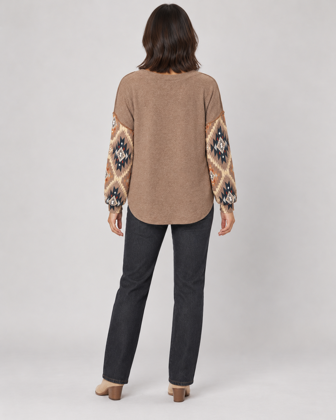Brown geometric pullover top, full-length back view