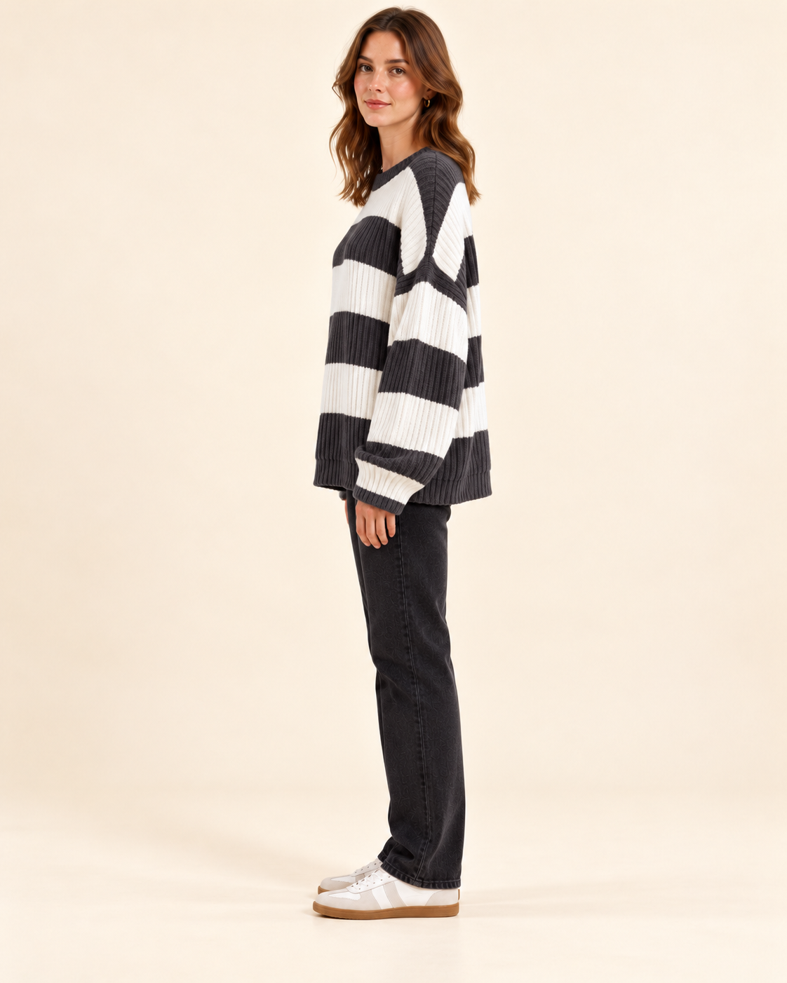 Grey and ivory striped knit pullover sweater, side profile view