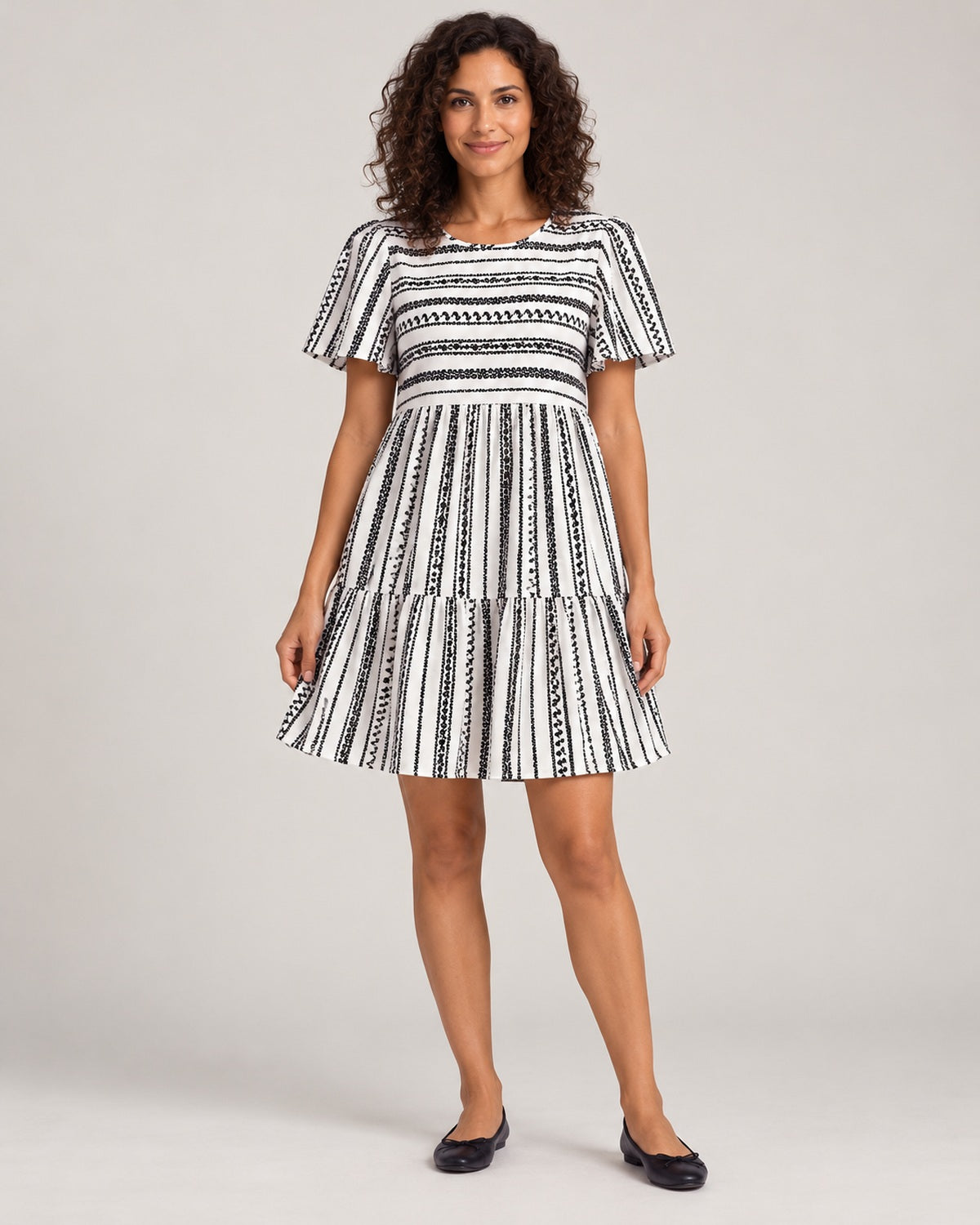 Full-length front view of the Black variant of the Women's Striped Round-Neck Tiered Dress