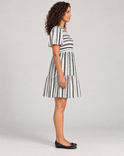Full-length side view of the Black variant of the Women's Striped Round-Neck Tiered Dress
