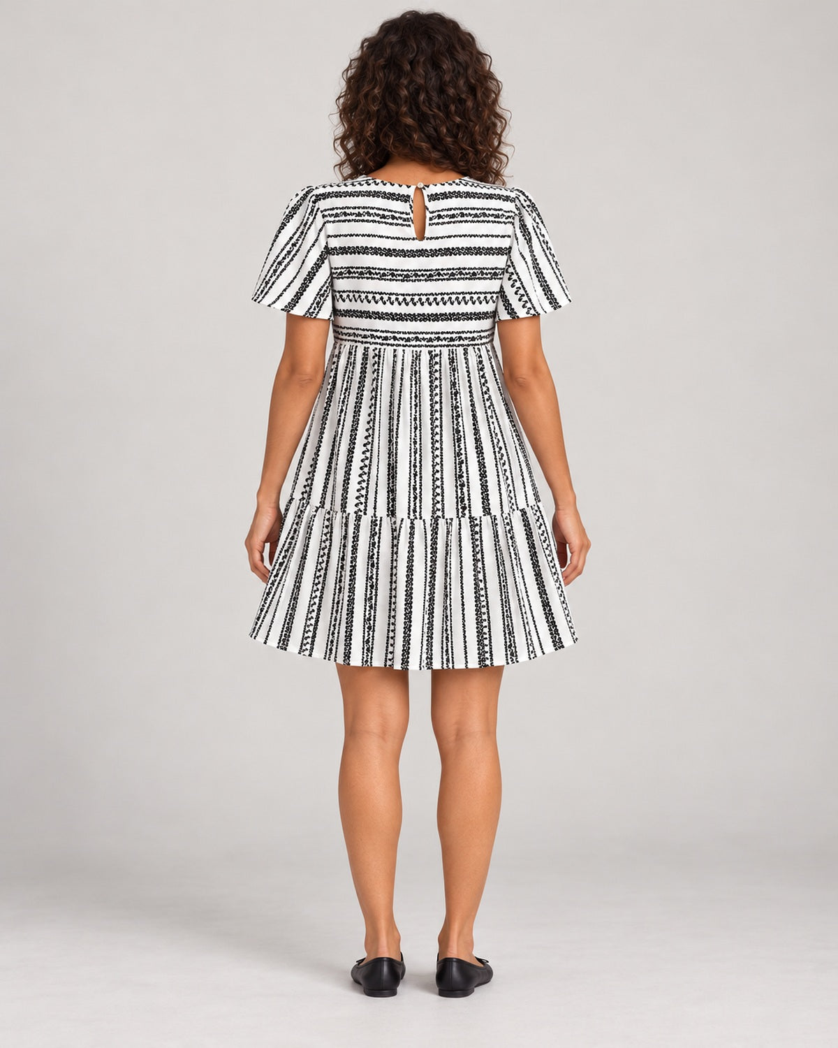 Full-length rear view showing the back keyhole of the Black variant dress