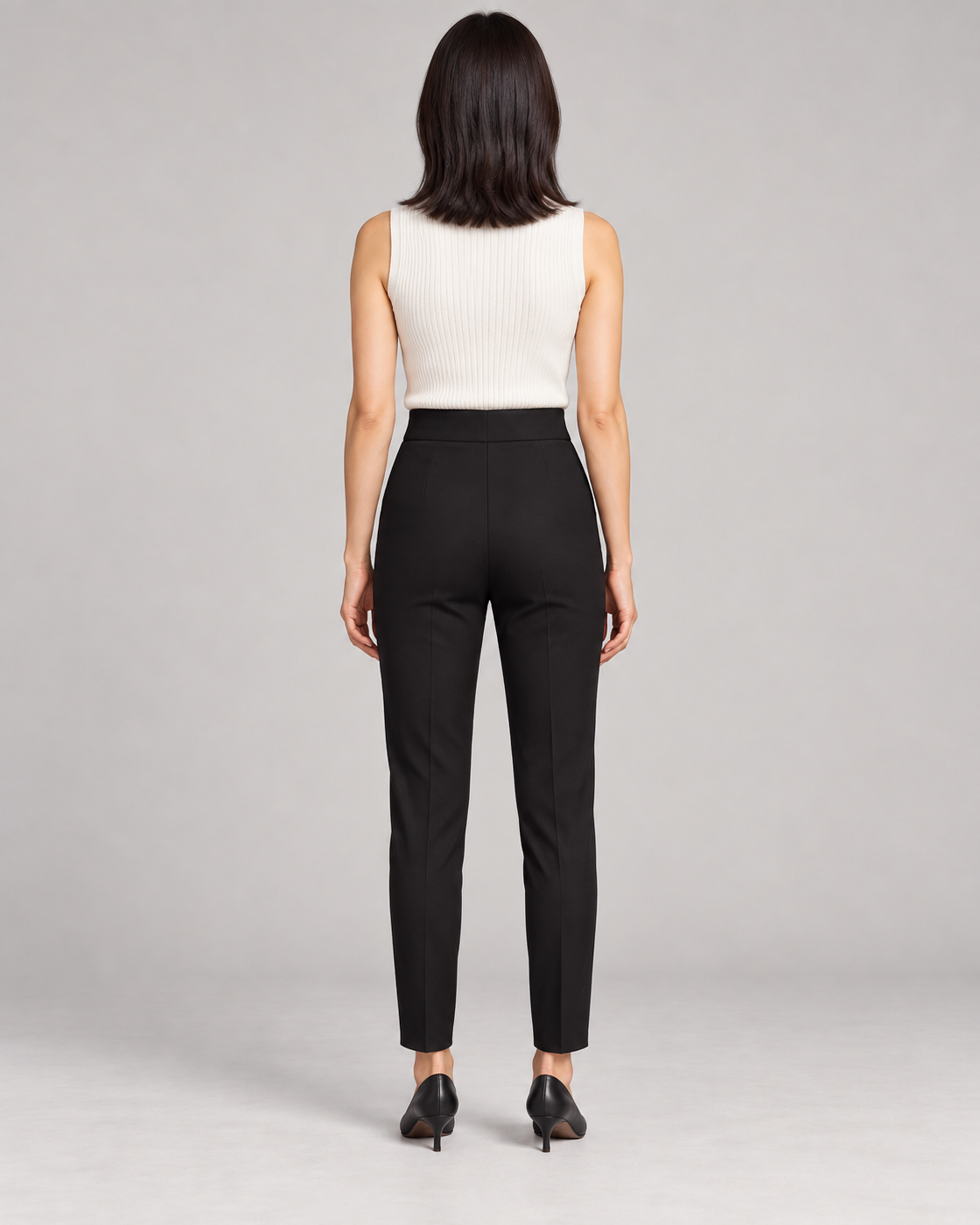 Women's High-Waist Tapered Pants in Black — Full-length rear view